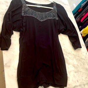 Pretty black top with open sleeve and sparkle neck details